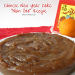 Chinese New Year steamed brown sugar cake with some oranges and lucky money envelopes