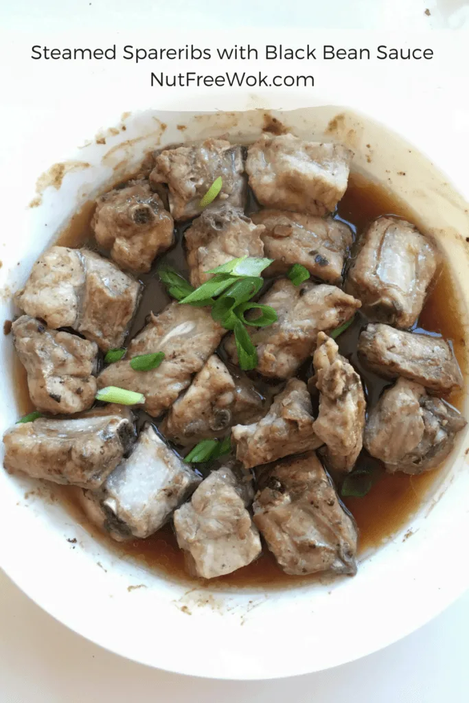 Overhead photo of Steamed Spare Ribs with Black Bean Sauce in a white bowl.