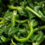 close up view of sauteed pea shoots