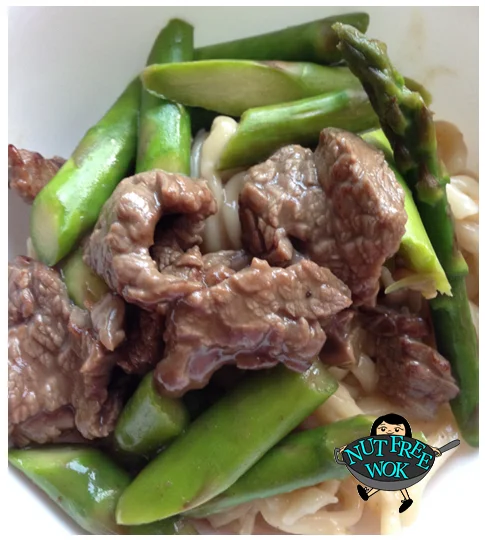 Asparagus beef stir fry served over udon noodles.