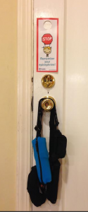 Our epi cases hanging on our kitchen doorknob with a reminder taped to the door!