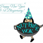 Nut Free Wok logo with a teal polka dotted party hat with a happy new year and first blogiversary