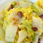close up of stir fried napa cabbage with dried shrimp and Chinese sausages