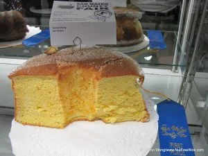 half of a cake displayed with a county fair