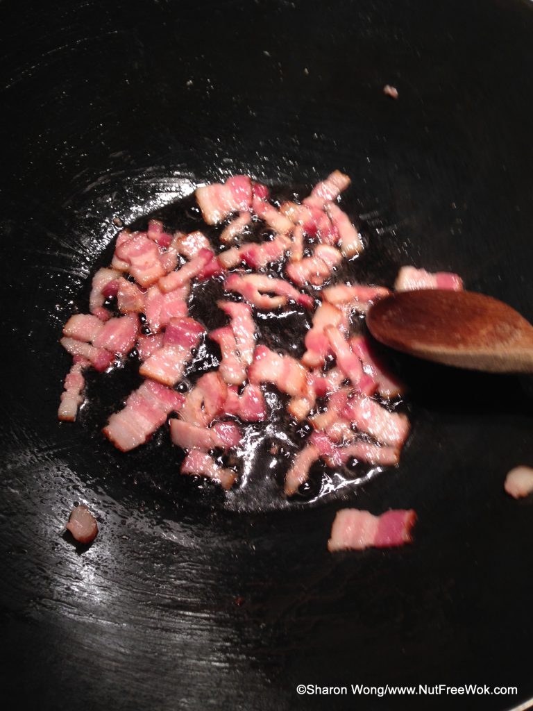 close up of bacon in a wok