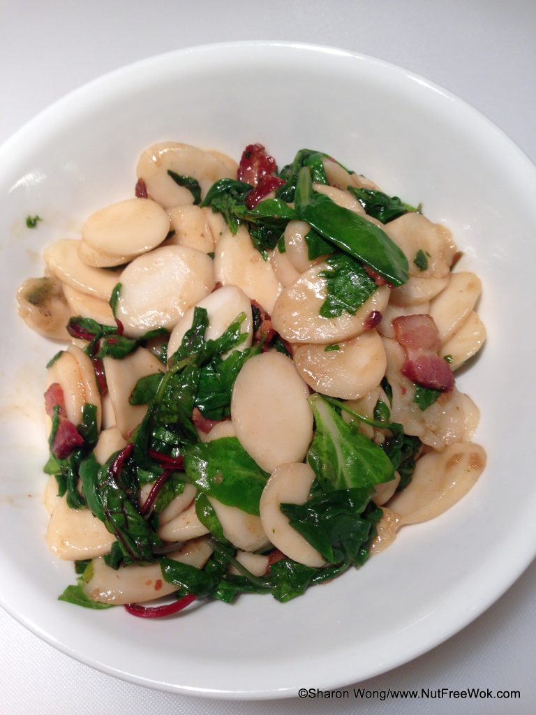 finished Korean Rice Ovalette with Bacon & Baby Greens Stir Fry in a white bowl