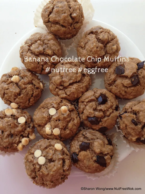 Banana Chocolate Chip Muffins, some are topped with white chocolate chips, some are topped with chocolate pieces