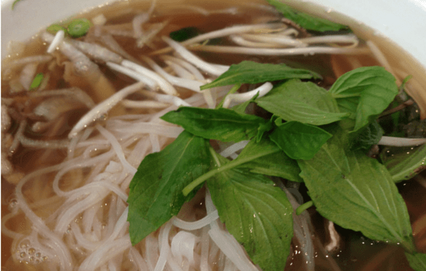 bowl of pho with basil garnish