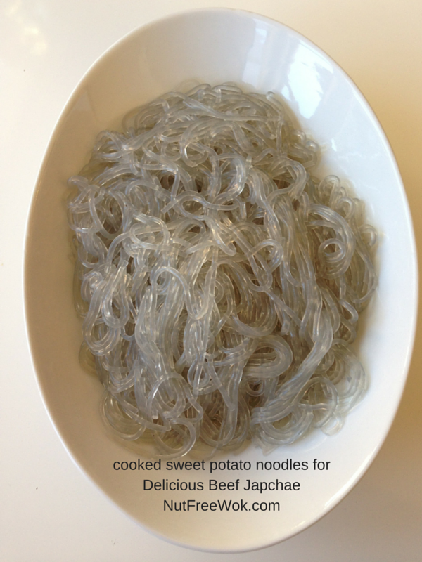 plain cooked sweet potato starch noodles for japchae in a white oval plate