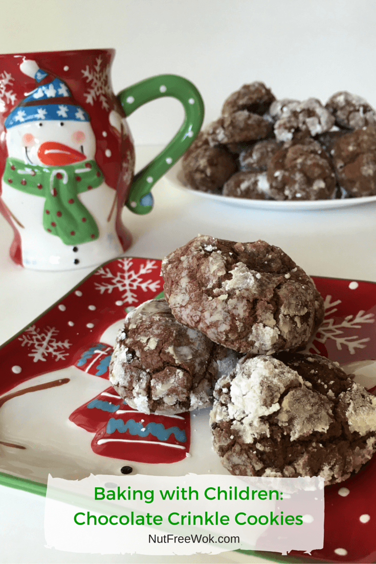 Baking with children, Chocolate Crinkle Cookies on a snowman festive plate with a snowman cup and a large plate of cookies in the background