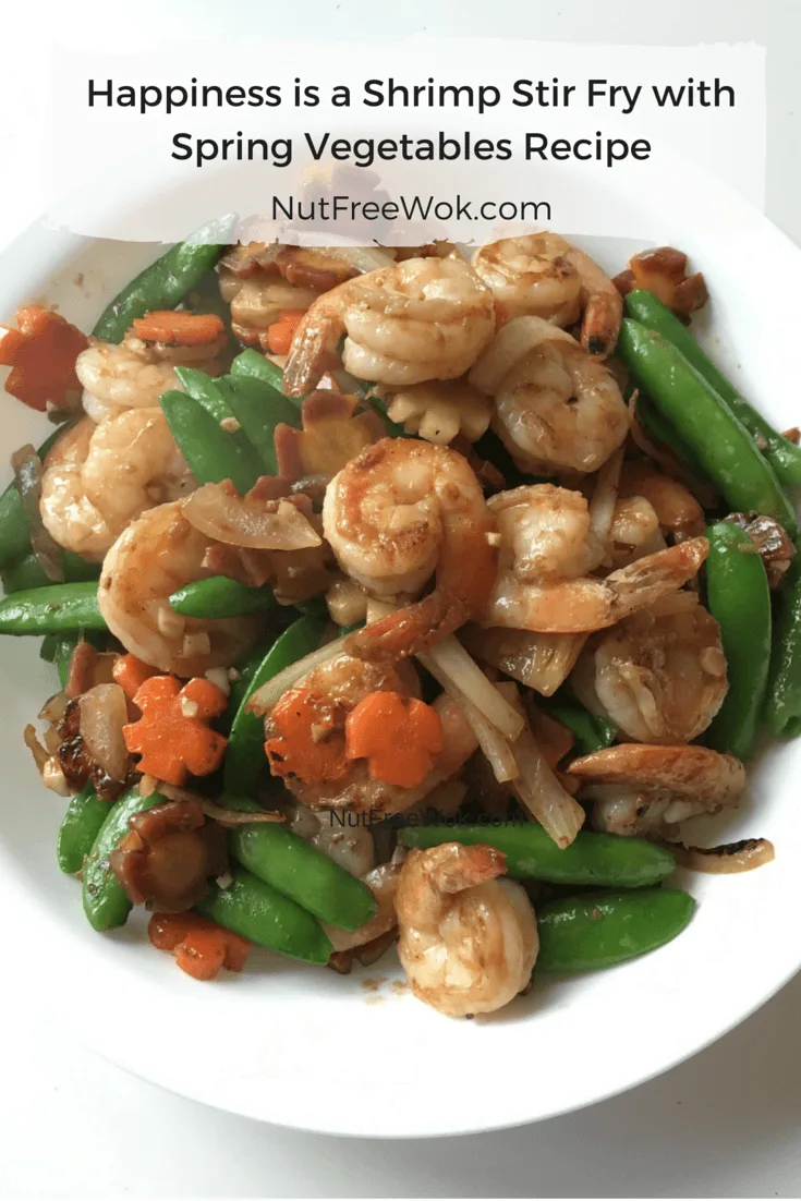 Shrimp stir fry in a white serving dish Happiness is a Shrimp Stir Fry with Spring Vegetables Recipe