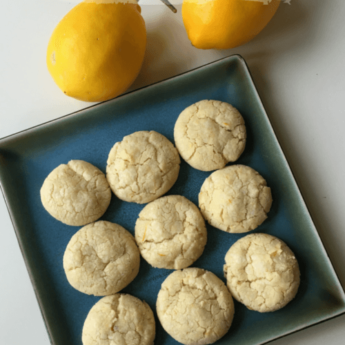 cookies on a blue square plate with two lemonsLemon Vanilla Crinkle Cookies Nut Free Wok