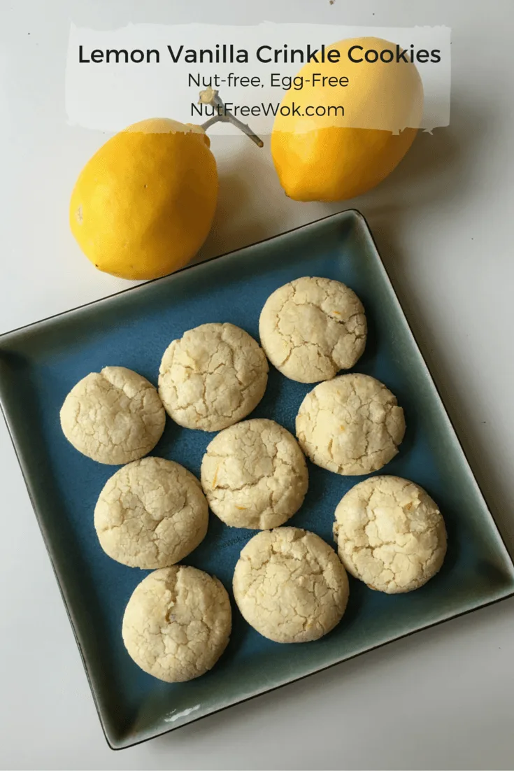 cookies on a blue square plate with two lemonsLemon Vanilla Crinkle Cookies Nut Free Wok