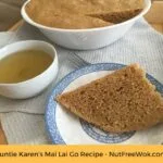 close up of a cup of tea with a slice of Auntie Karen's Mai Lai Go from NutFreeWok.com