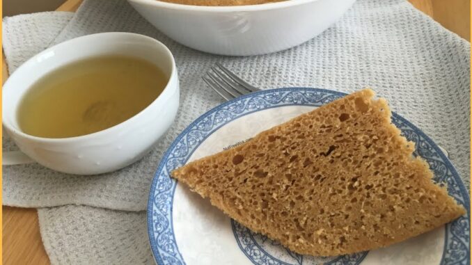 close up of a cup of tea with a slice of Auntie Karen's Mai Lai Go from NutFreeWok.com