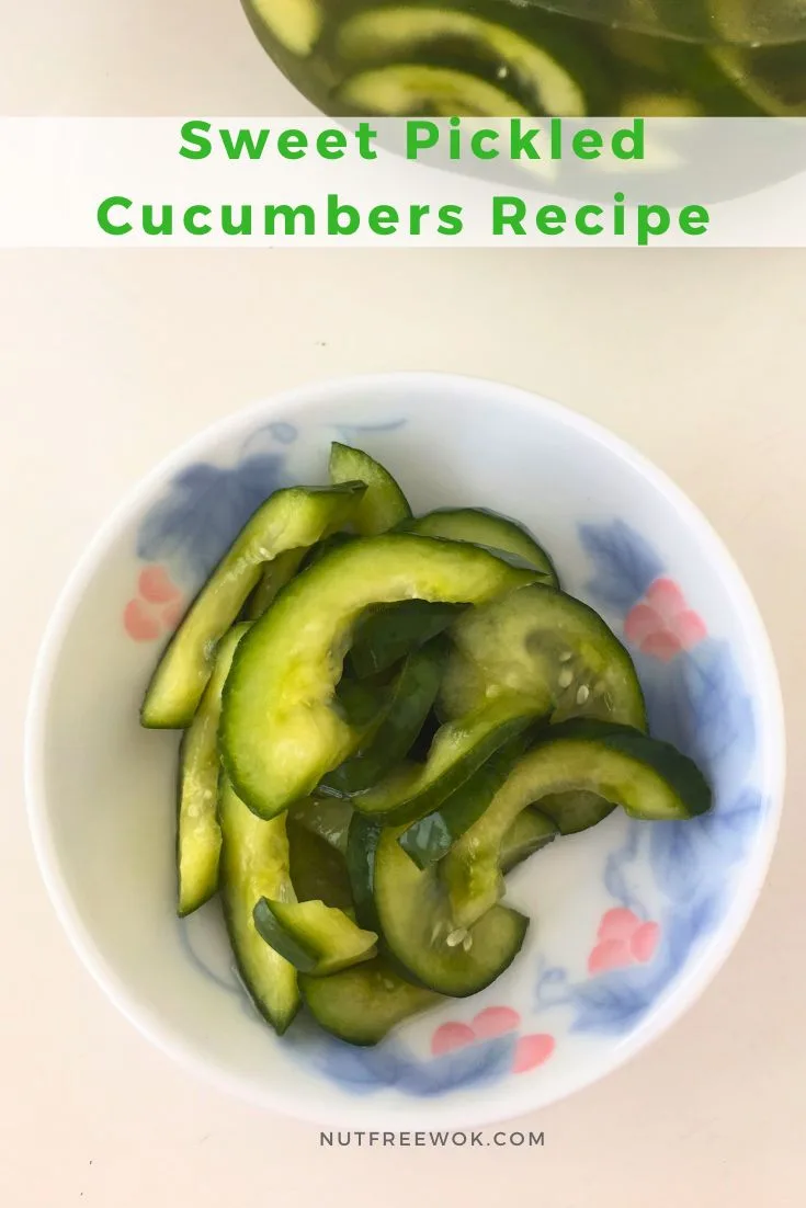 sweet pickled cucumbers served in a small round dish