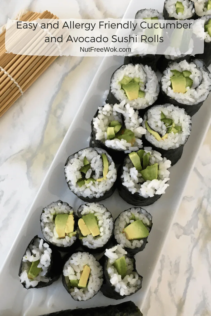 Easy and Allergy Friendly Cucumber and Avocado Sushi Rolls on a white rectangular serving dish