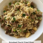 smoked duck fried rice in a white serving bowl