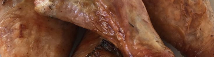 close up of roasted turkey drumsticks