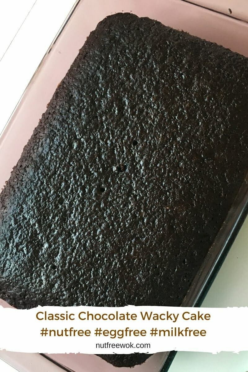 Classic Chocolate wacky cake baked in a 9x13 pan, looks very dark and chocolatey. 