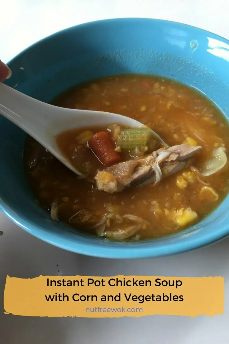 enjoy a bowl of Instant Pot Chicken Soup with corn and vegetables, recipe by Nut Free Wok