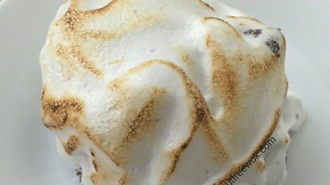 An allergy friendly aquafaba baked Alaska that has been browned with a kitchen torch that is ready to eat! #eggfree #nutfree