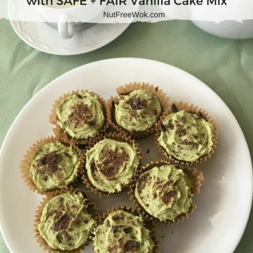 A plate of Matcha Chocolate Chip Cupcakes with a cup of green tea and a teapot