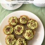 A plate of Matcha Chocolate Chip Cupcakes with a cup of green tea and a teapot