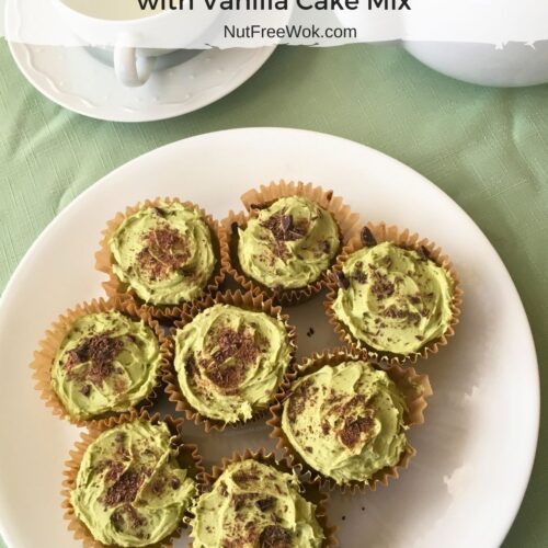 A plate of Matcha Chocolate Chip Cupcakes with a cup of green tea and a teapot