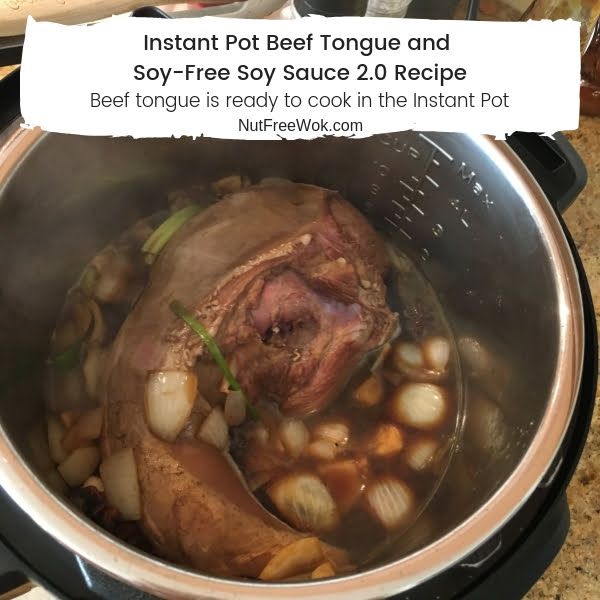 Beef tongue is ready to cook in the Instant Pot with spices and sauce ingredients. 