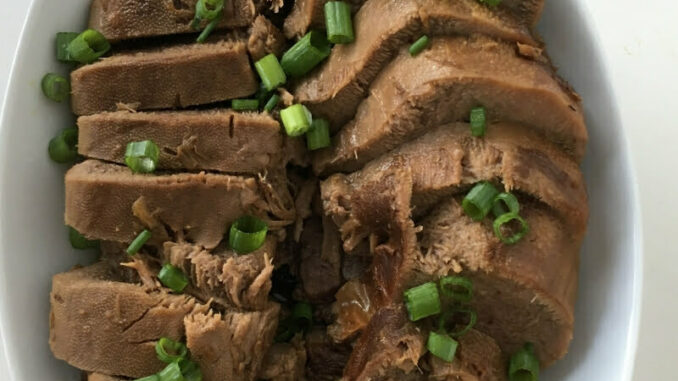 Instant Pot Beef Tongue, sliced, arranged, and ready to serve with a drizzle of soy-free soy sauce!