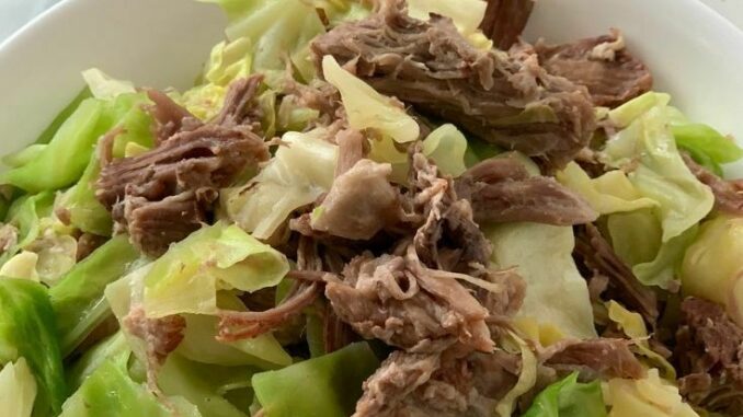 Instant Pot Kalua Pork with cabbage in a large serving bowl.