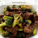 Broccoli Beef is ready to eat, photographed in a white serving bowl.