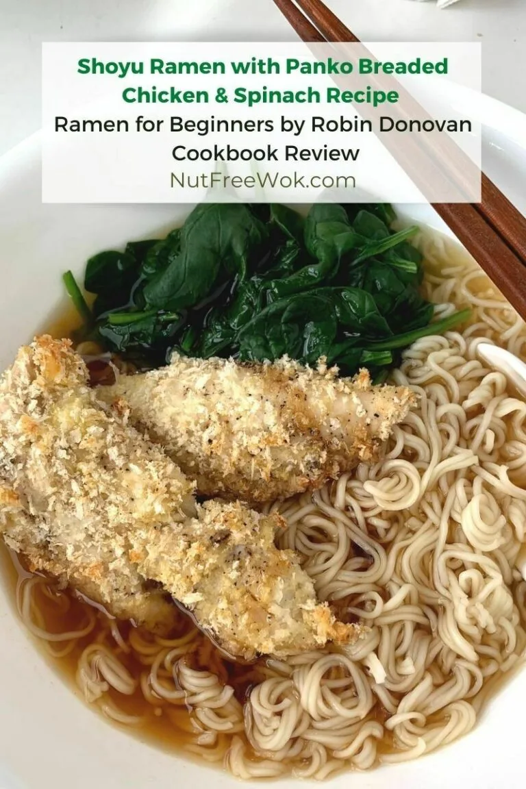 Shoyu ramen with panko breaded chicken and spinach in a white bowl with chopsticks and a soup spoon