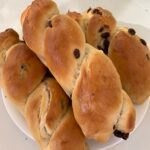 3 raisin bread on a plate