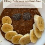 chocolate oatmeal topped with sliced bananas and chia seeds arranged in a smile