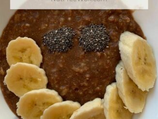 chocolate oatmeal topped with sliced bananas and chia seeds arranged in a smile