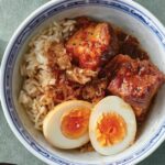 lu rao fan, braise pork and egg rice bowl close up