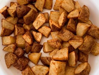 potato home fries on a white serving plate