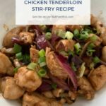 chicken tenderloin stir fry in a white serving bowl