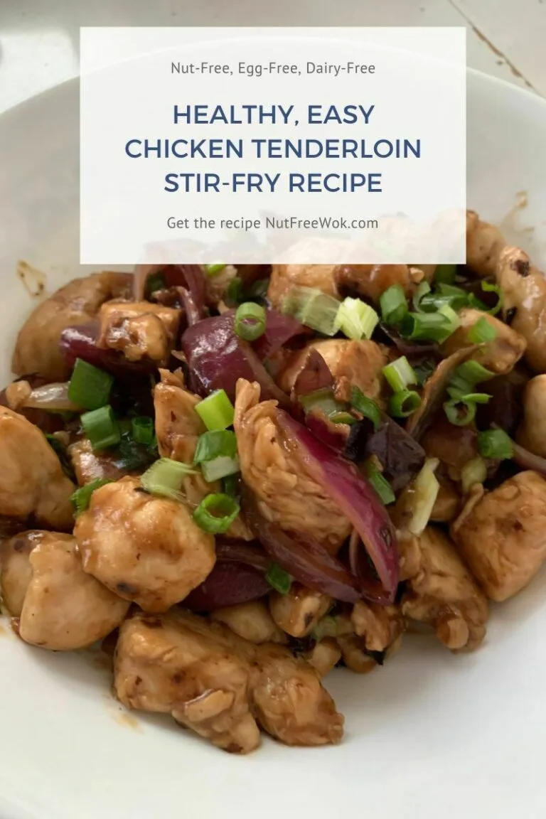 chicken tenderloin stir fry in a white serving bowl