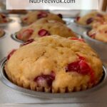 close up of cranberry orange muffin in a muffin tin