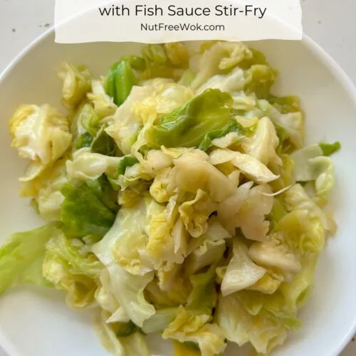 garlicky cabbage with fish sauce in a white bowl