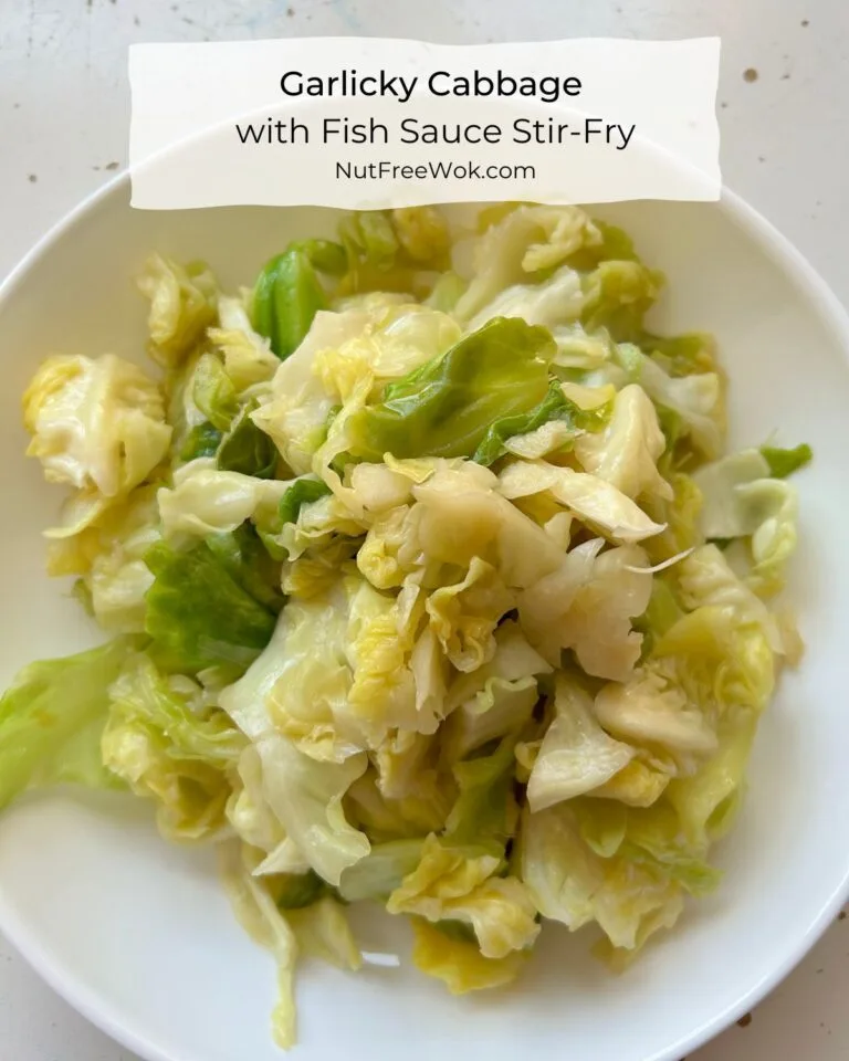 garlicky cabbage with fish sauce in a white bowl