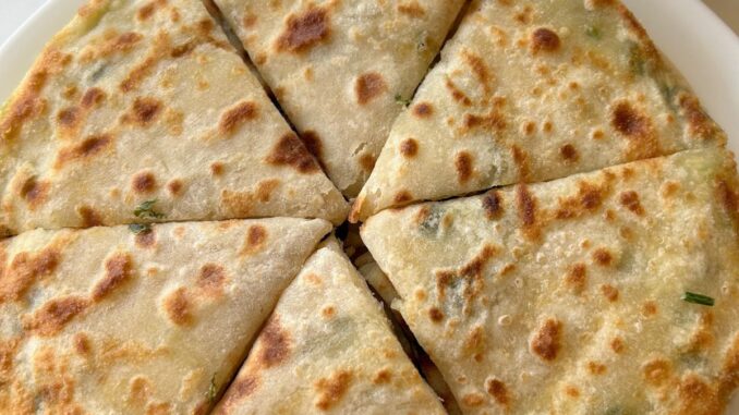 Scallion pancakes on a white plate