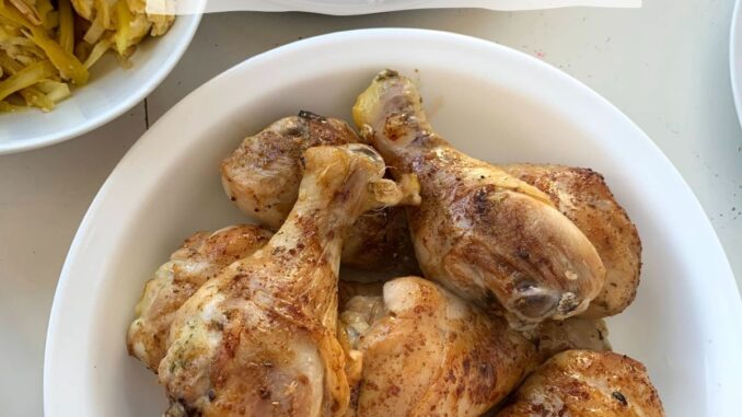 plate of chicken drumsticks, baked and ready to eat