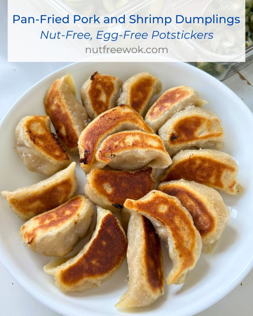 Pan-fried pork and shrimp dumplings arranged in a circular pattern with crispy bottom sides up