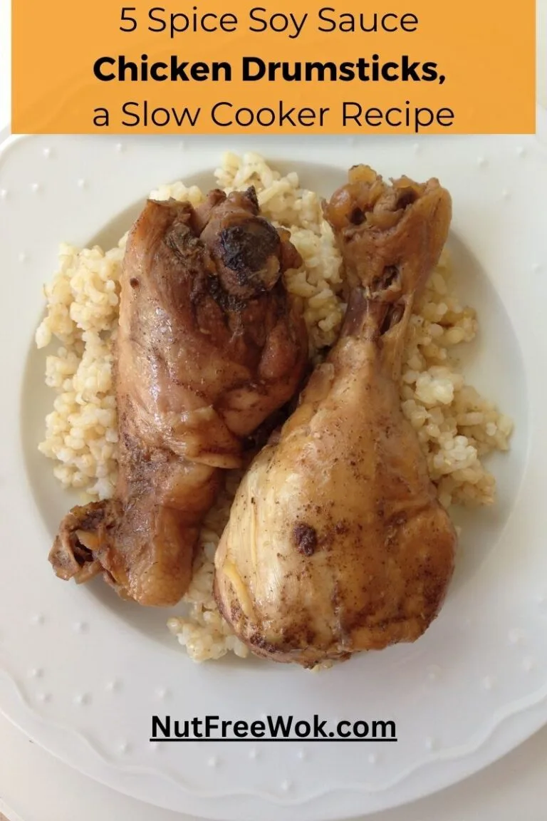 2 chicken drumsticks, plated with brown rice.