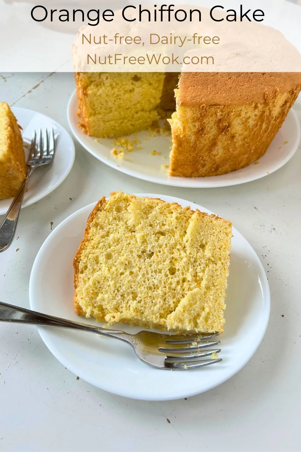 slices of orange chiffon cake on a white cake plate with a fork