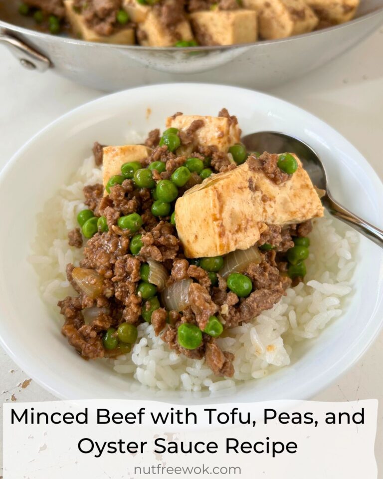 Minced Beef with Tofu, Peas, and Oyster Sauce over rice in a white bowl with a spoon.